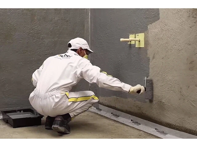 Applying First Waterproofing Coat On Walls And Floor For Waterproofing