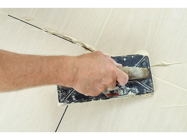 Grouting The Bathroom Floor Tiles With Grout White Joint Filler